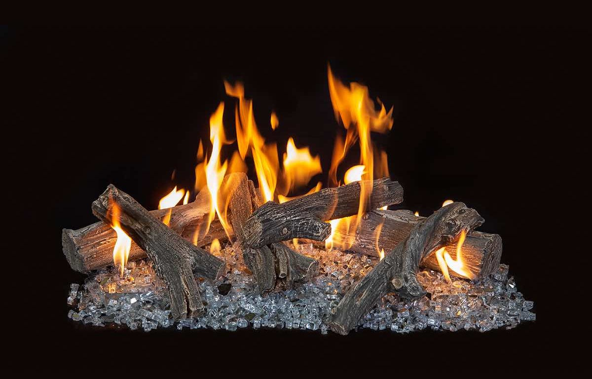 Fireplace logs and glass beads with flames on a black background